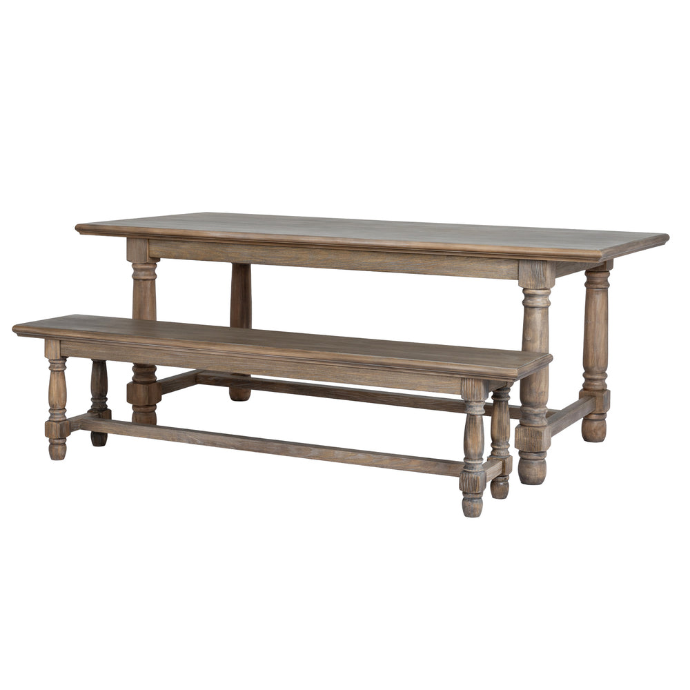 A rustic wooden dining table with a matching bench, both featuring a weathered gray-brown finish and turned legs, shown on a plain white background.
