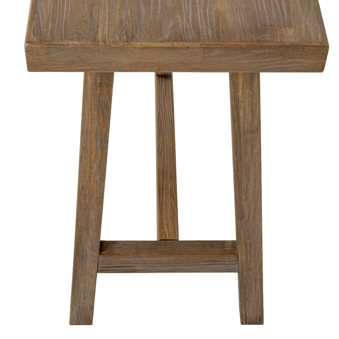 Wooden stool with a rustic finish on a white background