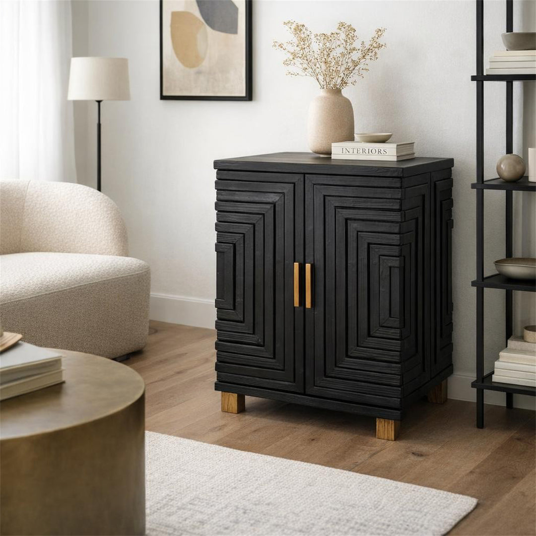 Black cabinet with decorative patterns in a living room setting