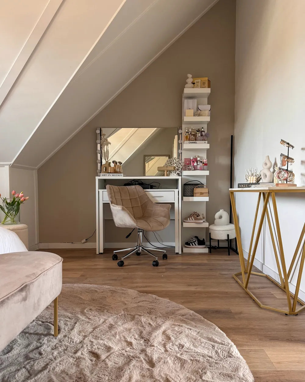Modern home office with desk, chair, and decorative items.