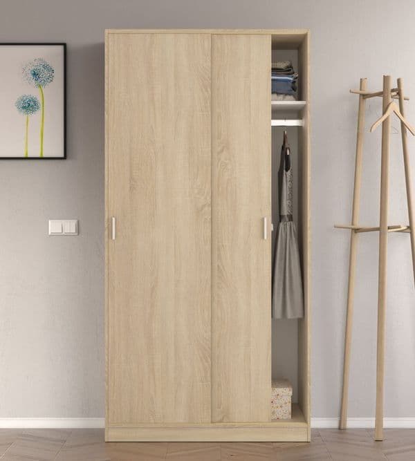 Wooden wardrobe with open door revealing clothes, next to a coat rack against a wall.