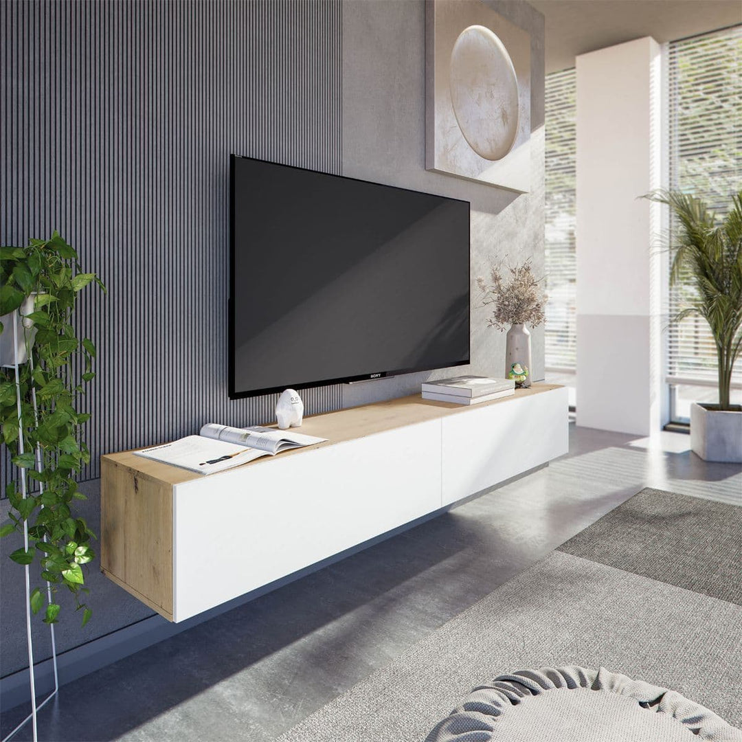 Modern living room with a TV mounted on a wooden and white entertainment console.