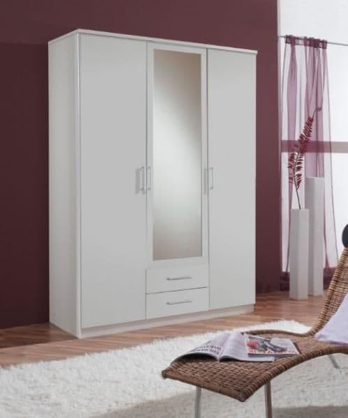 White wardrobe with a mirror in a room with a purple wall and a chair.