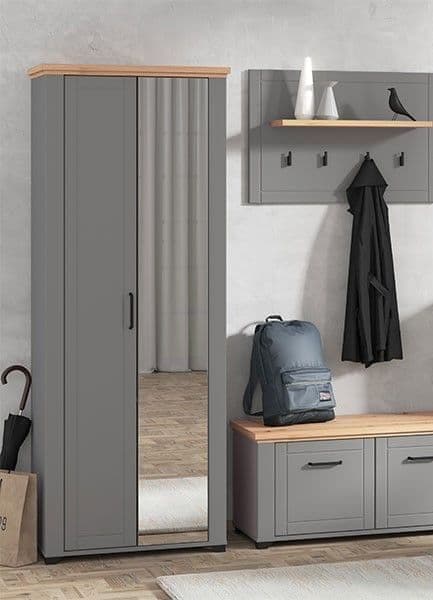 Gray wardrobe with wooden top and bench in a room setting.
