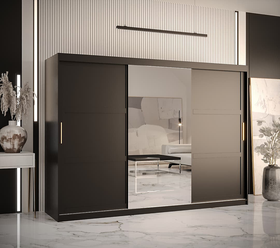 Modern sliding wardrobe with glass doors in a stylish room.