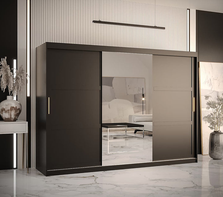 Modern sliding wardrobe with glass doors in a stylish room.