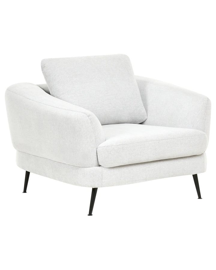White armchair with a pillow on a white background