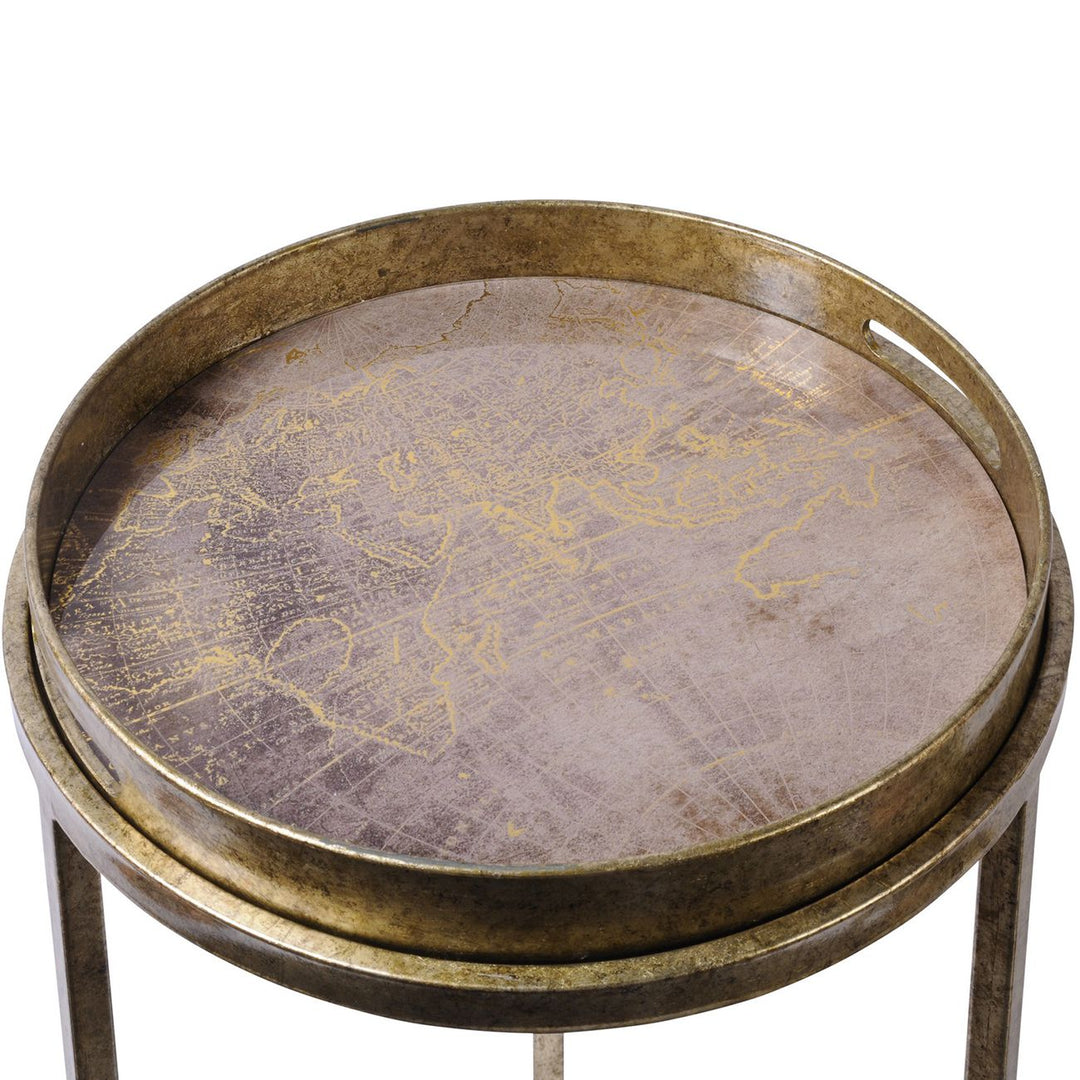 Round metal table with world map design on a white background