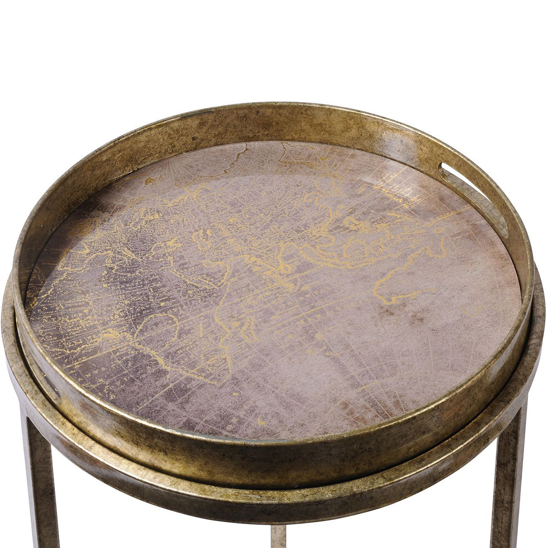 Round metal table with world map design on a white background