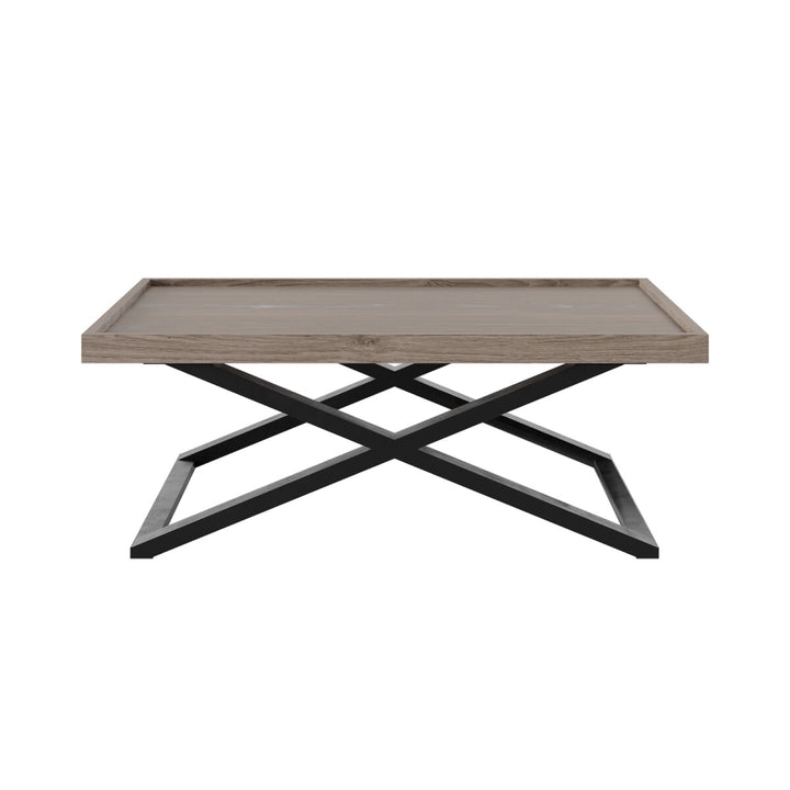 Coffee table with wooden top and black metal base on a white background