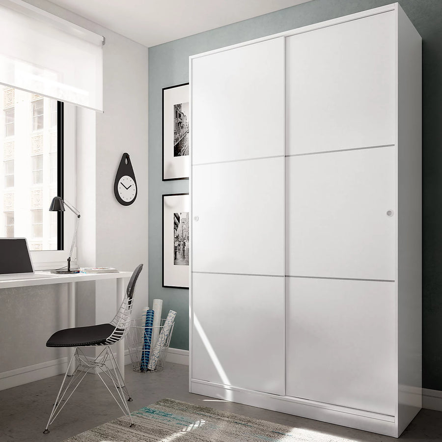 Modern bedroom with a large white wardrobe, desk, and chair.