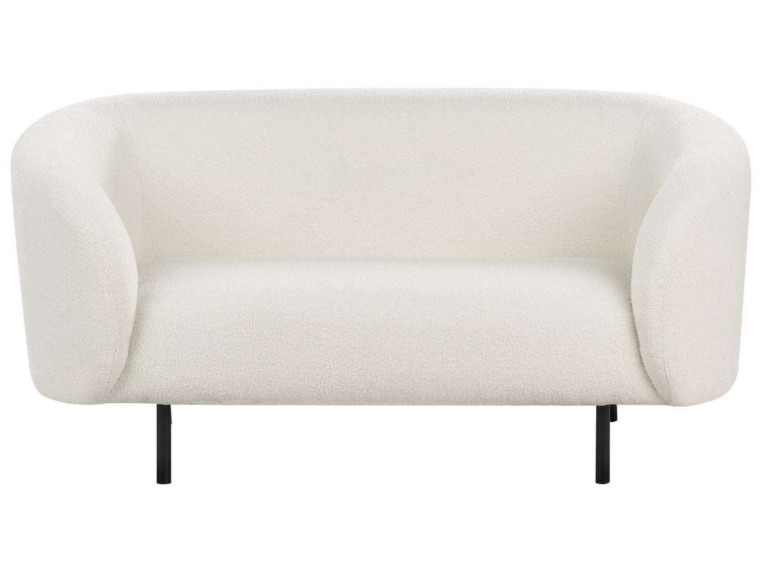 White sofa with black legs on a white background