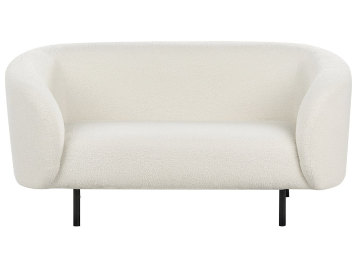 White sofa with black legs on a white background