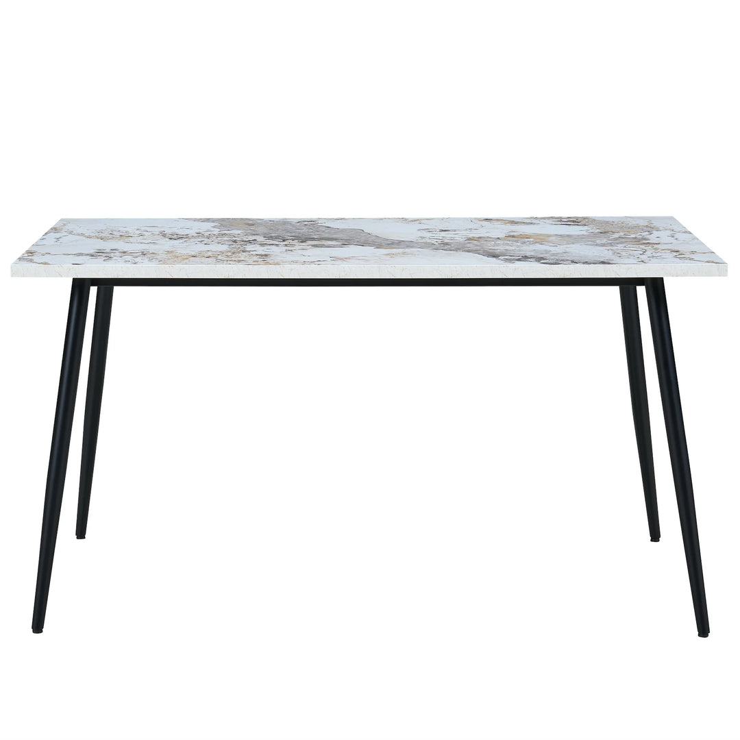 Dining table with marble-like top and black legs on a white background