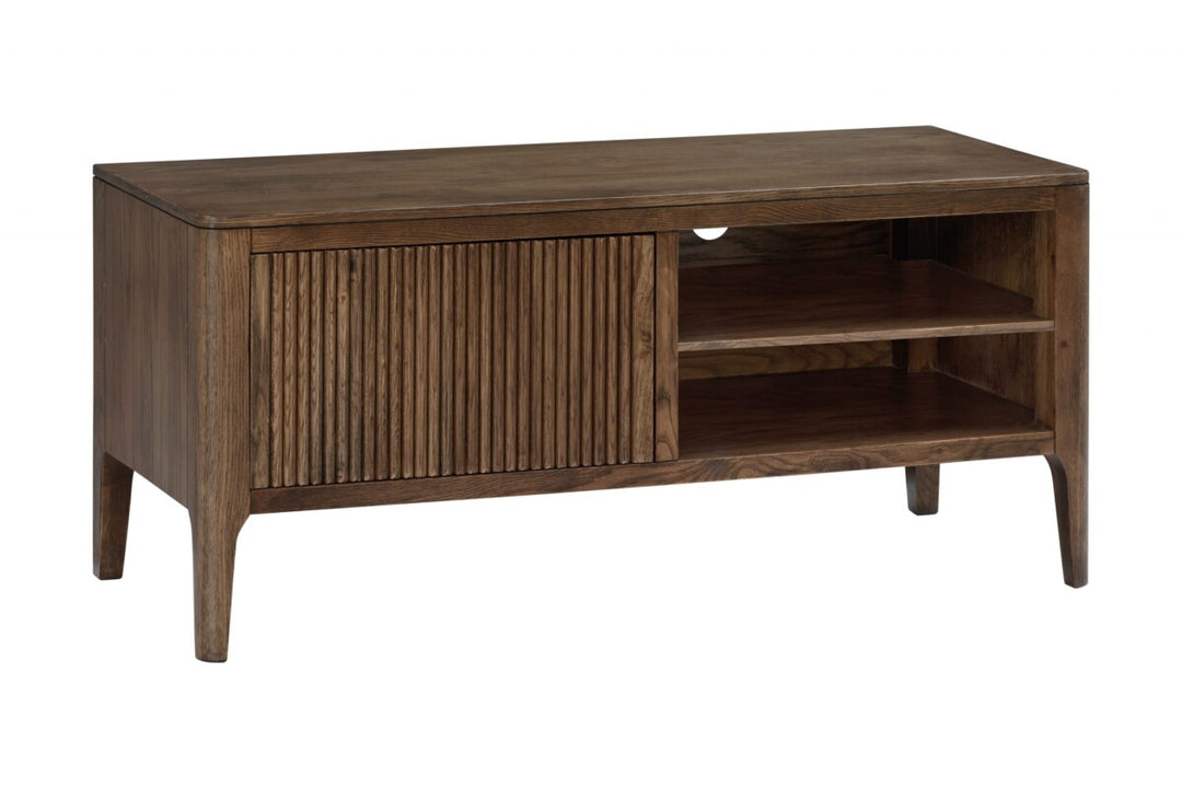 Wooden TV stand with a slatted door on a white background