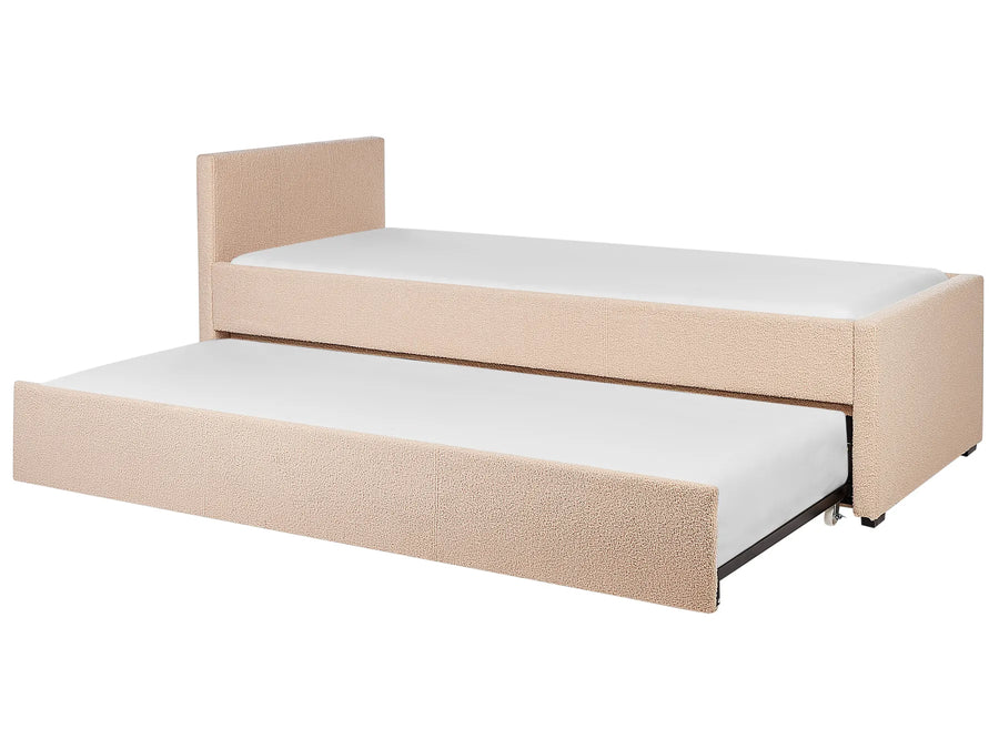 Beige upholstered bed with a white mattress on a white background