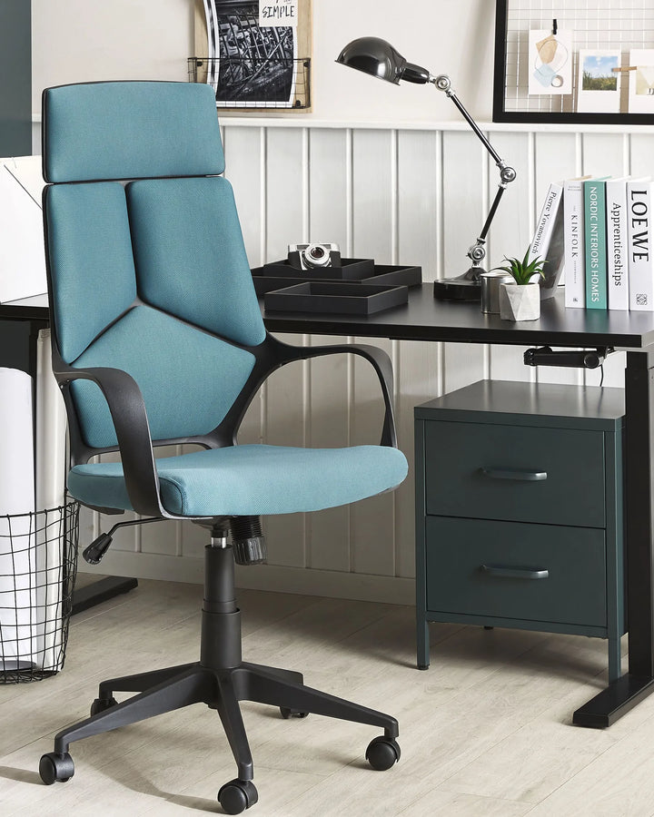 Blue office chair in an office setting with a desk and decor.