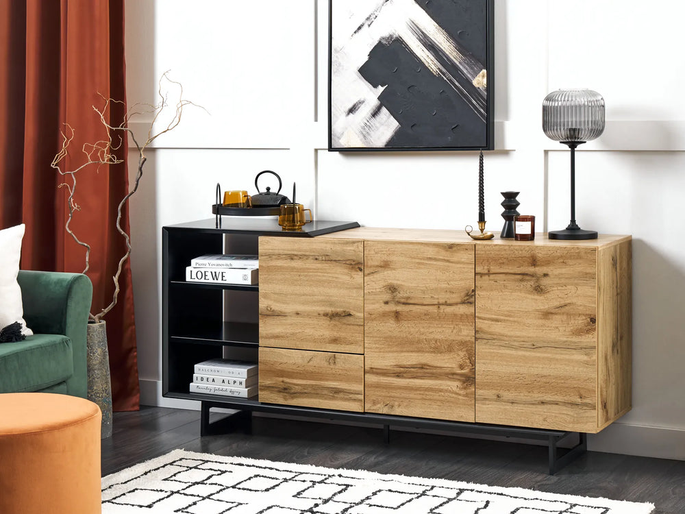 Wooden sideboard in a living room setting with decor items and furniture.
