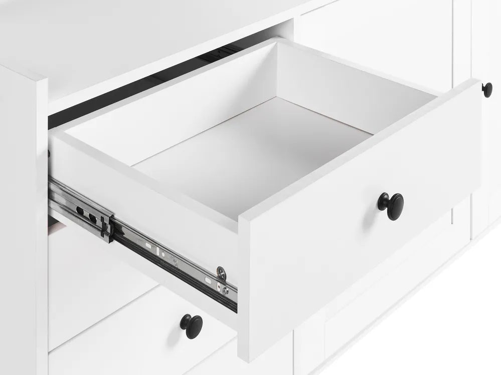 Open white drawer with black handle on a white background