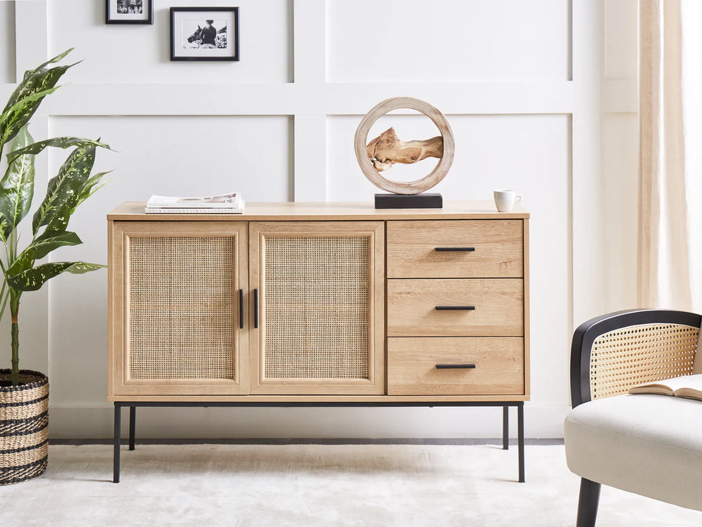 Wooden sideboard with wicker doors in a living room setting