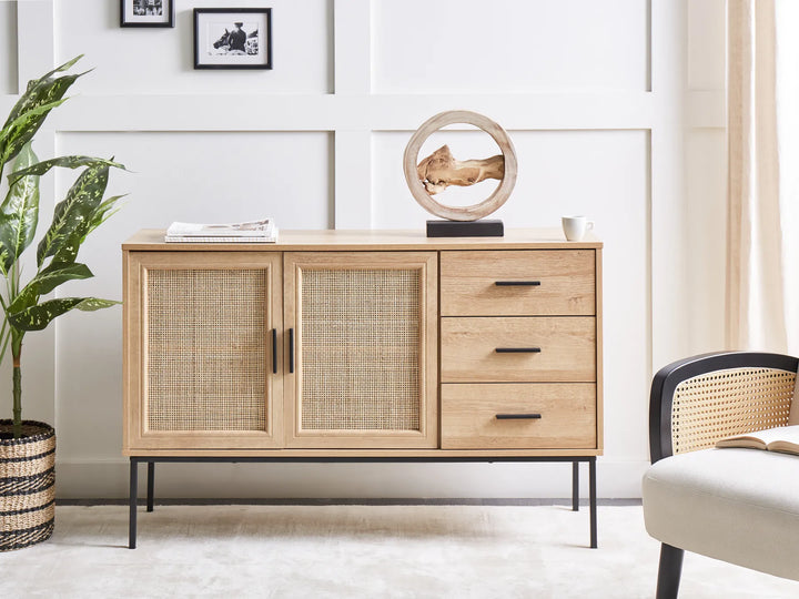 Wooden sideboard with wicker doors in a living room setting
