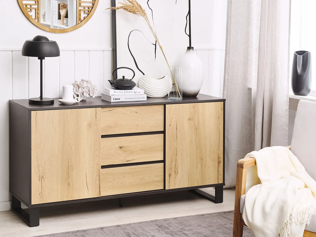 Wooden sideboard with black accents in a living room setting