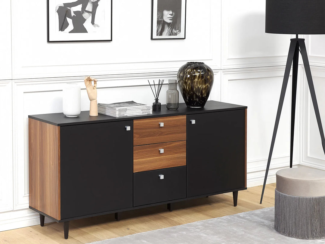Modern sideboard with wooden and black design in a room setting.