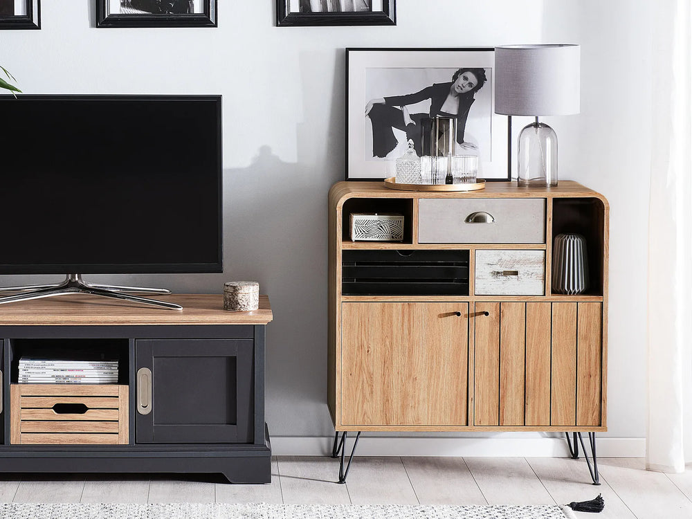 Modern living room with a television and wooden sideboard.