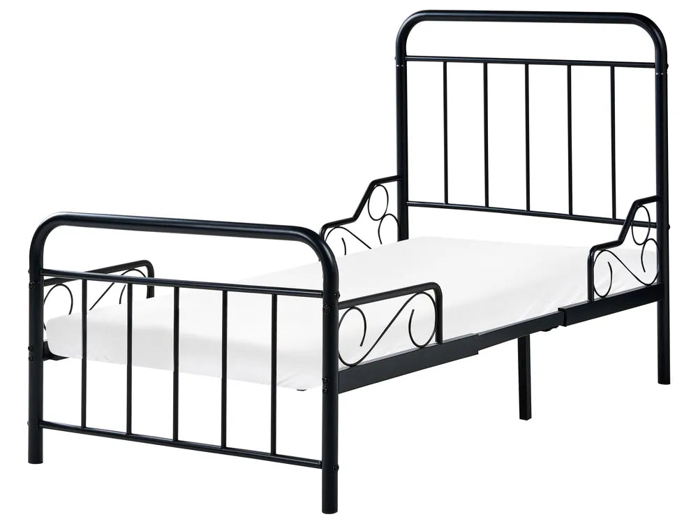 Black metal bed frame with white mattress on a white background