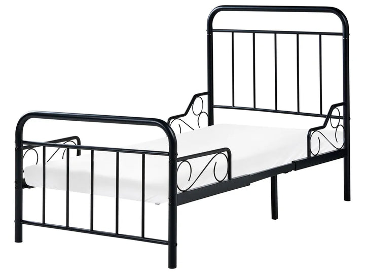 Black metal bed frame with white mattress on a white background