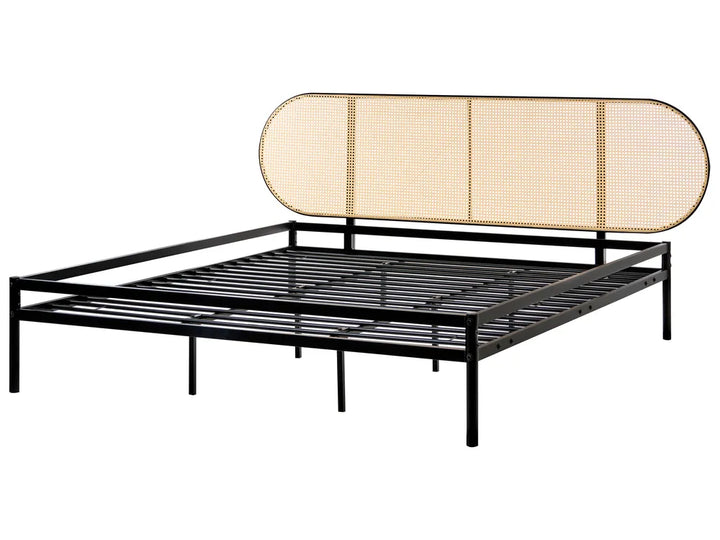 Black metal bed frame with a beige woven headboard on a white background