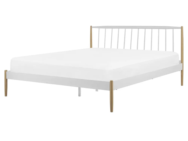 White metal bed frame with wooden legs on a white background