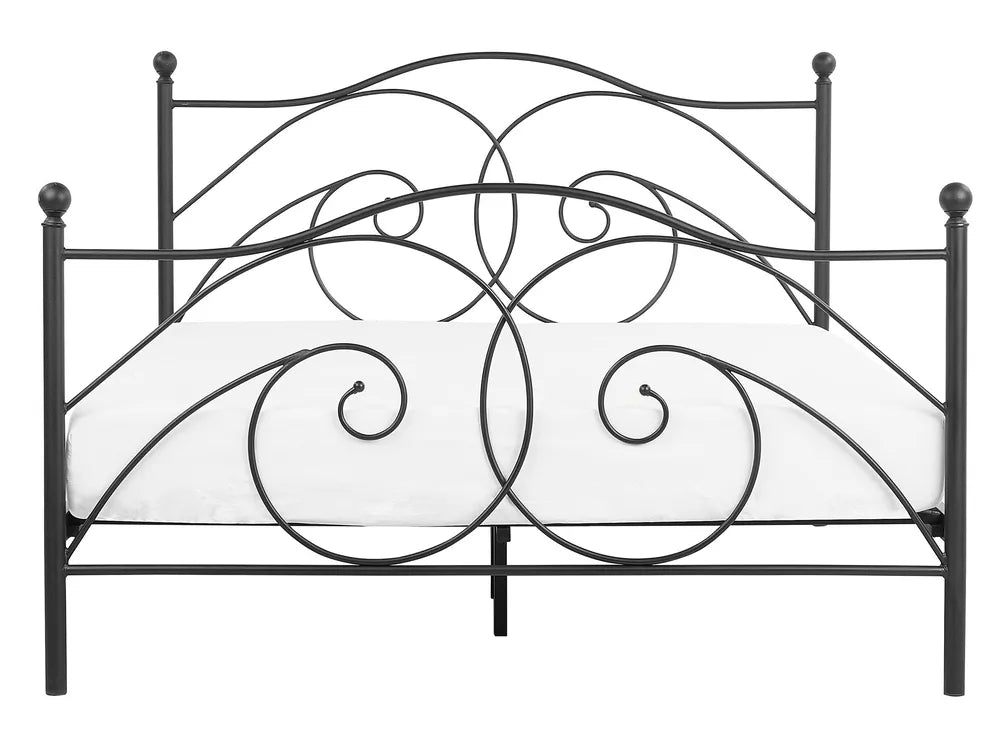 Decorative metal bed frame with intricate designs on a white background