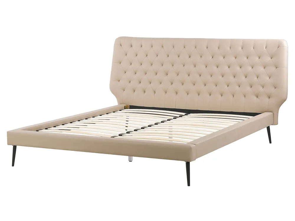 Beige upholstered bed frame on a white background
