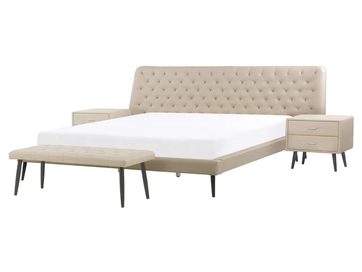 Beige upholstered bed with tufted headboard and matching ottoman on a white background