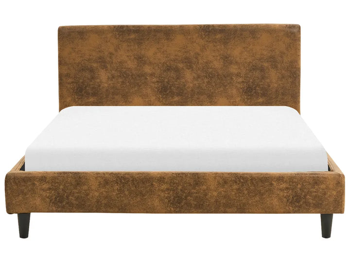 Brown upholstered bed frame with white mattress on a white background