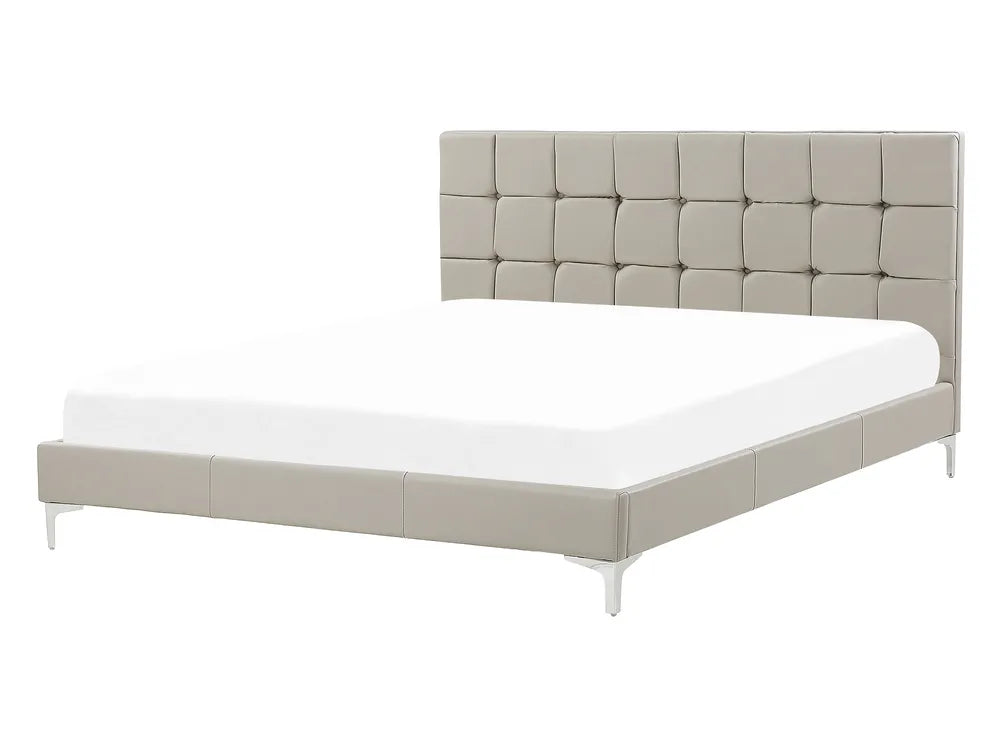 Beige upholstered bed with white mattress on a white background
