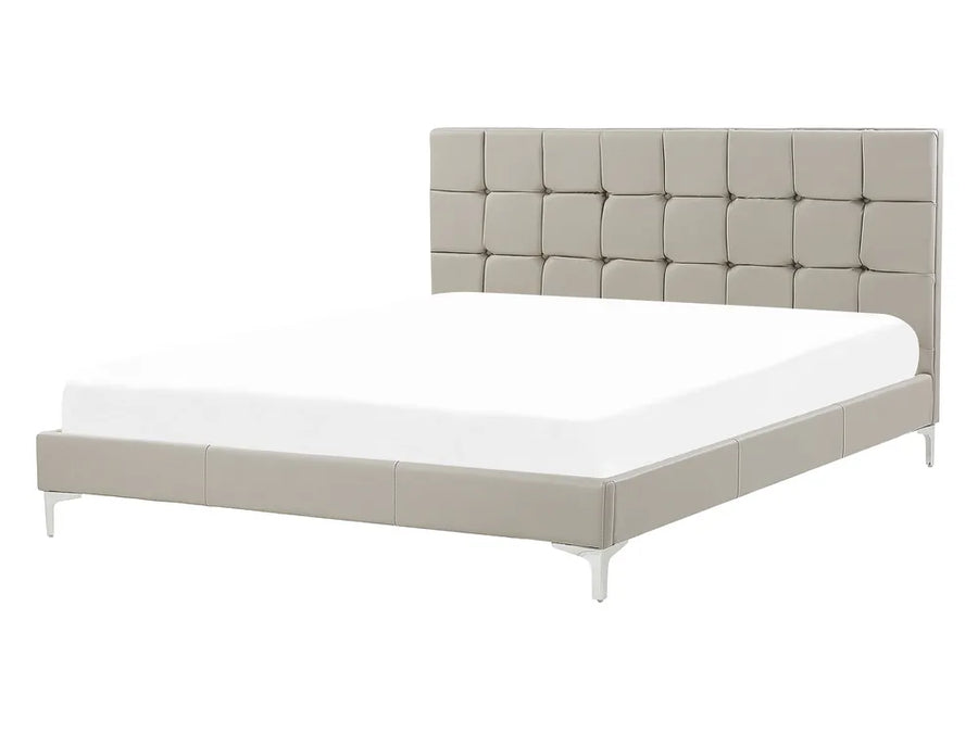 Beige upholstered bed with white mattress on a white background