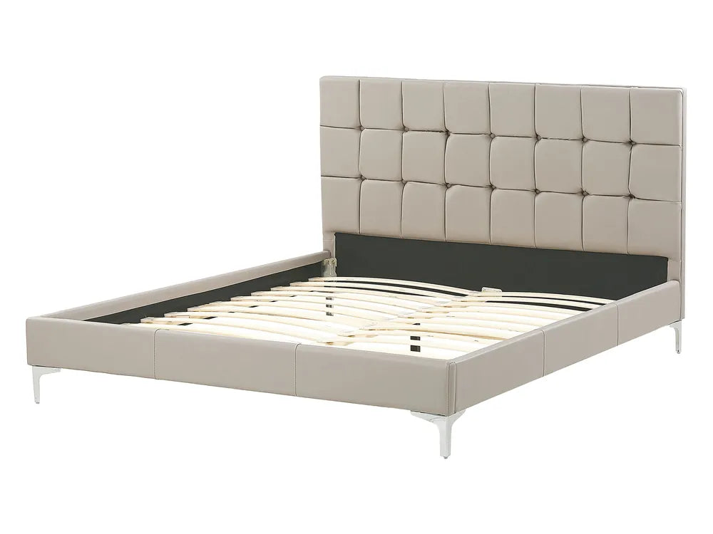 Beige upholstered bed with tufted headboard on a white background