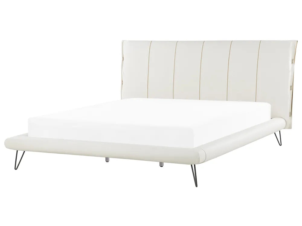 White bed with striped headboard on a white background