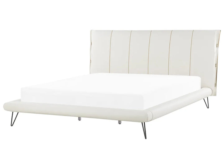 White bed with striped headboard on a white background