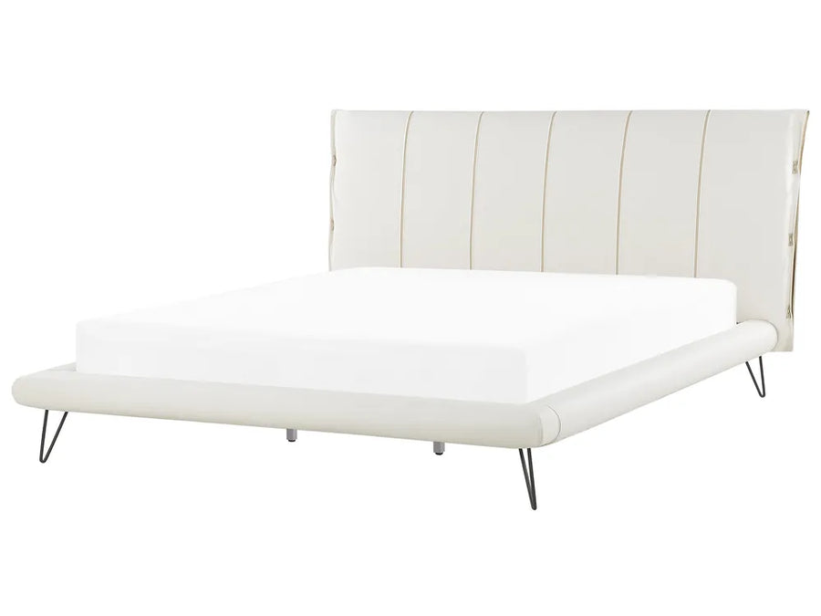 White bed with striped headboard on a white background