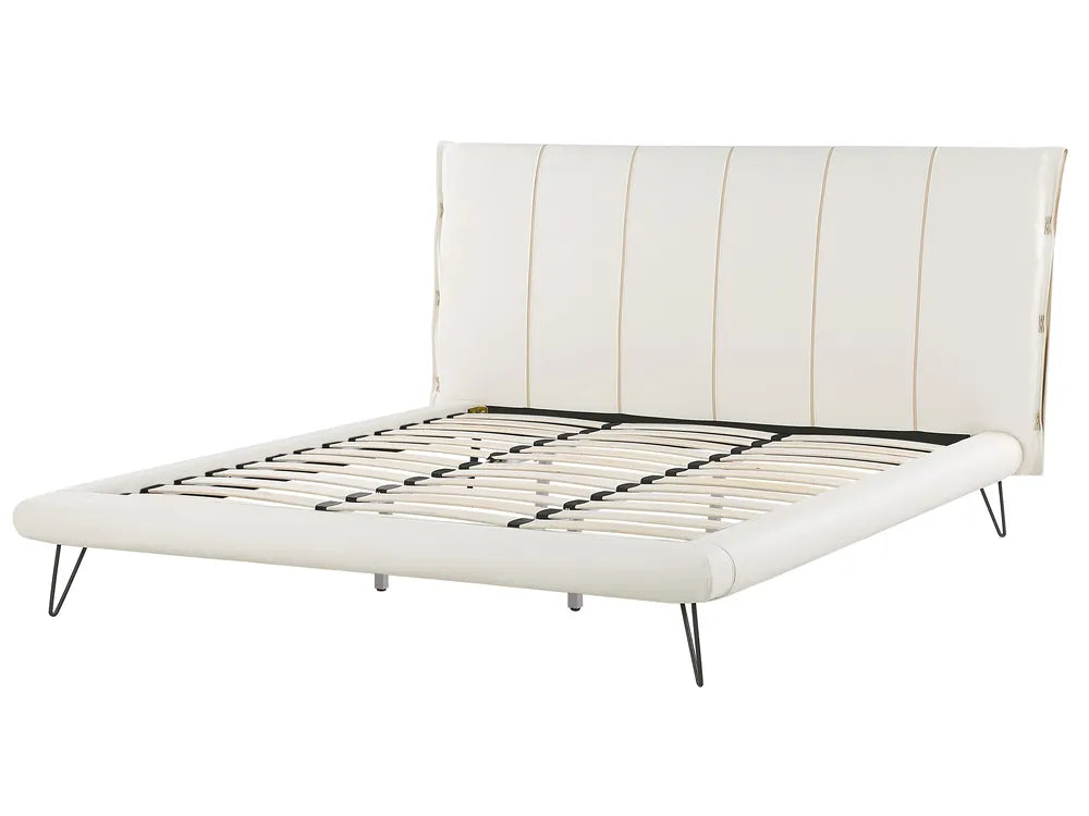 White bed frame with black metal legs on a white background