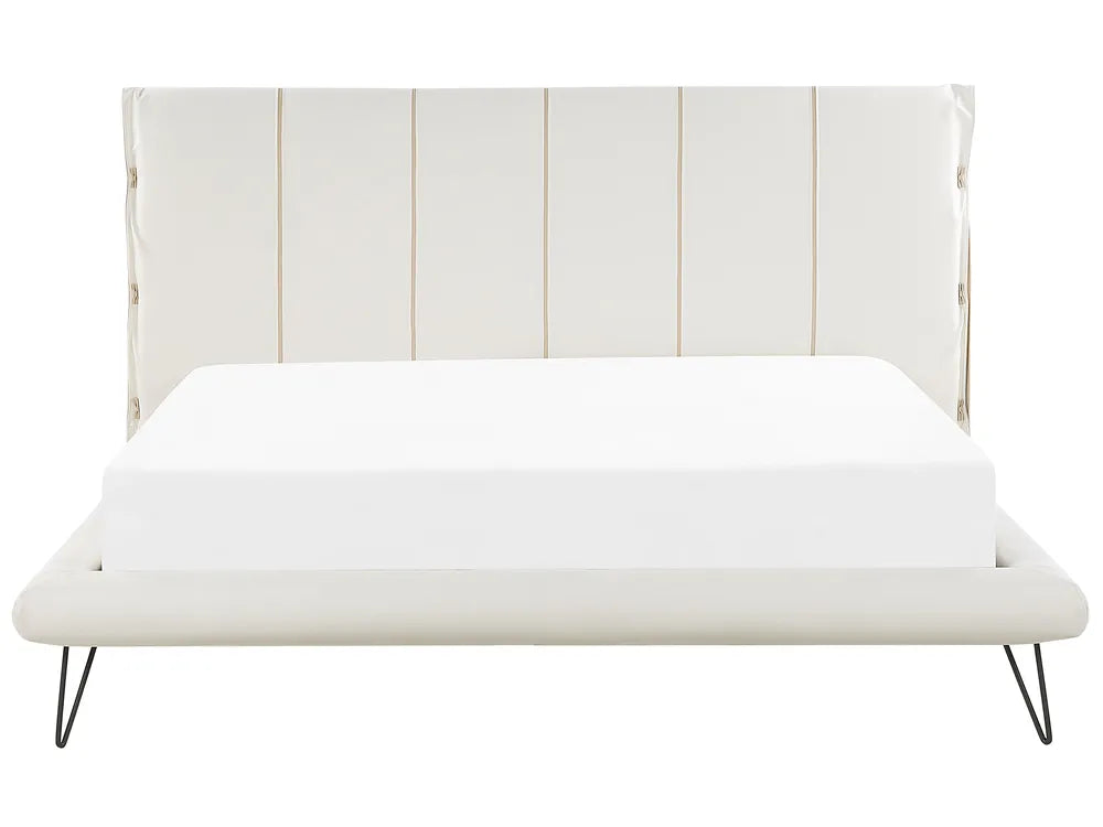 White bed with a striped headboard on a white background