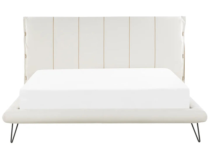 White bed with a striped headboard on a white background