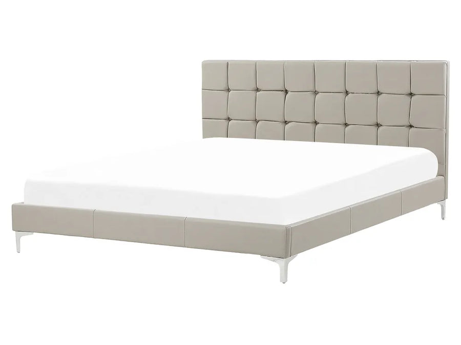 Beige upholstered bed with tufted headboard on a white background