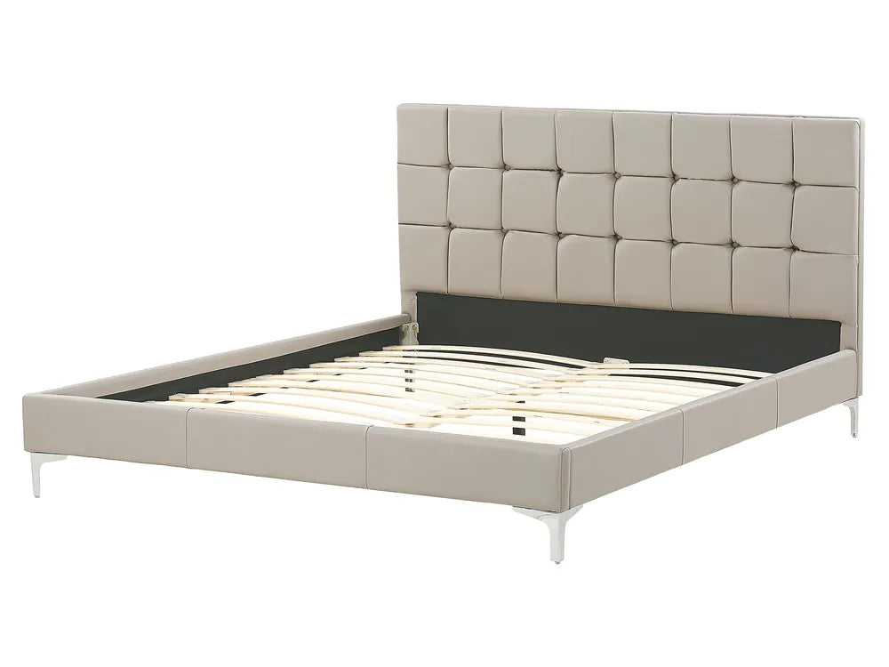 Beige upholstered bed frame on a white background