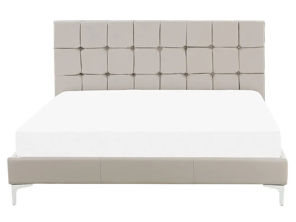 Beige upholstered bed with tufted headboard on a white background