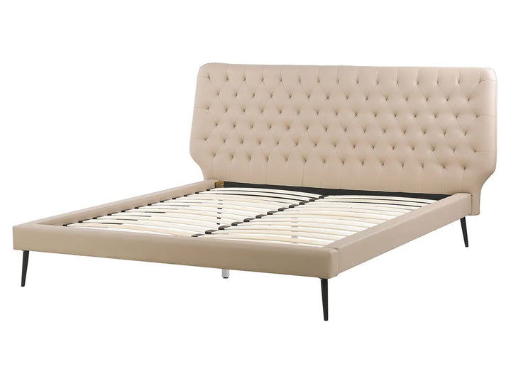 Beige upholstered bed frame with tufted headboard on a white background
