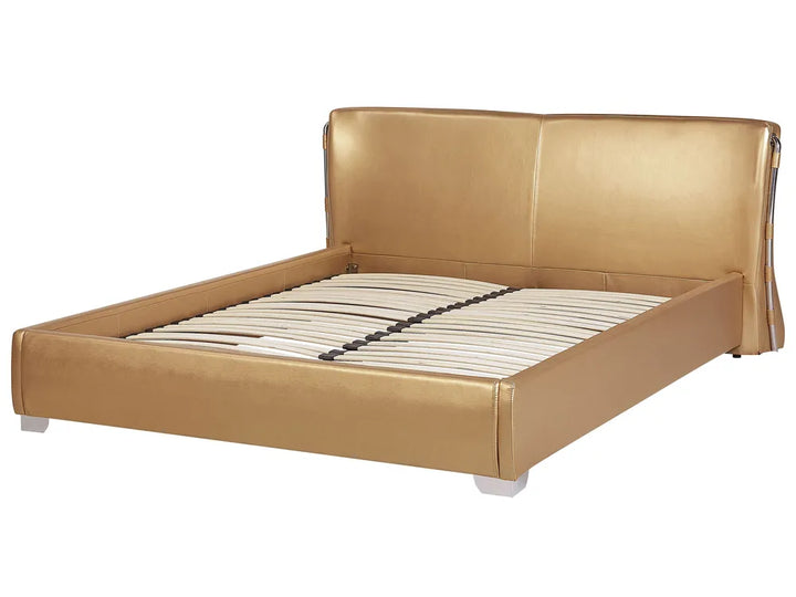 Gold bed frame on a white background